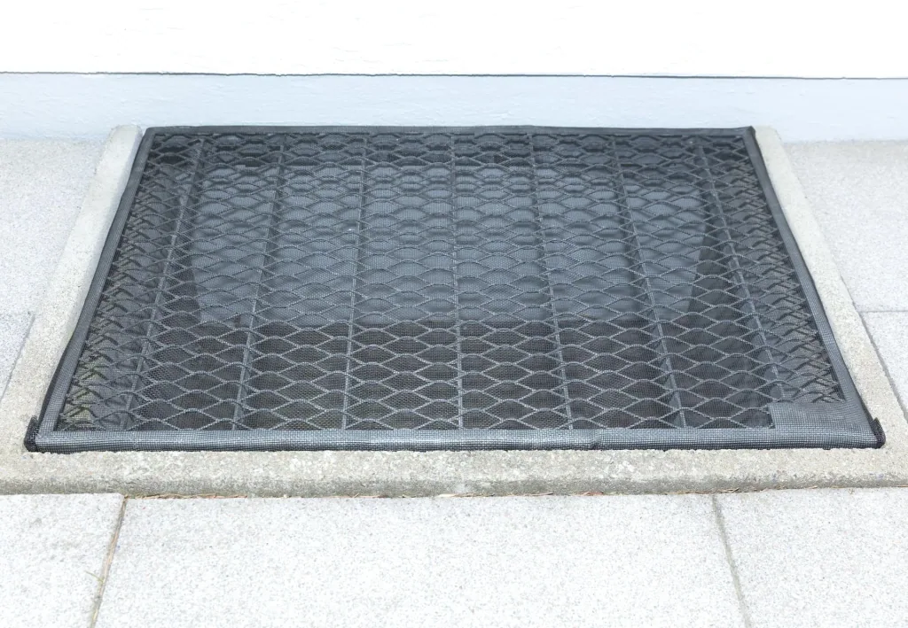 Dirt and small animal deflectors for light shafts, fiberglass fabric