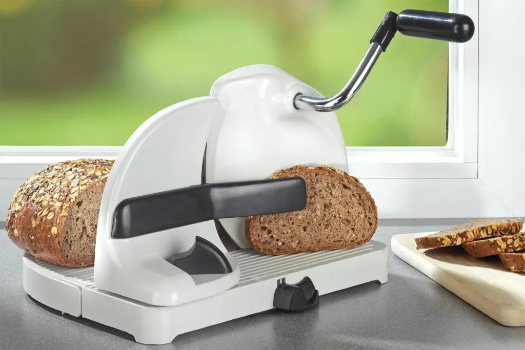 Bread slicer with hand crank