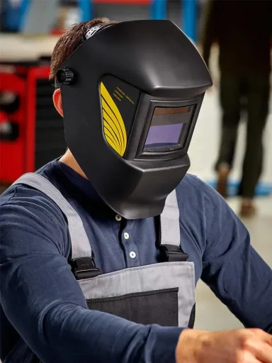 Welding helmet with automatic darkening system