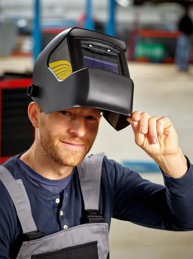Welding helmet with automatic darkening system