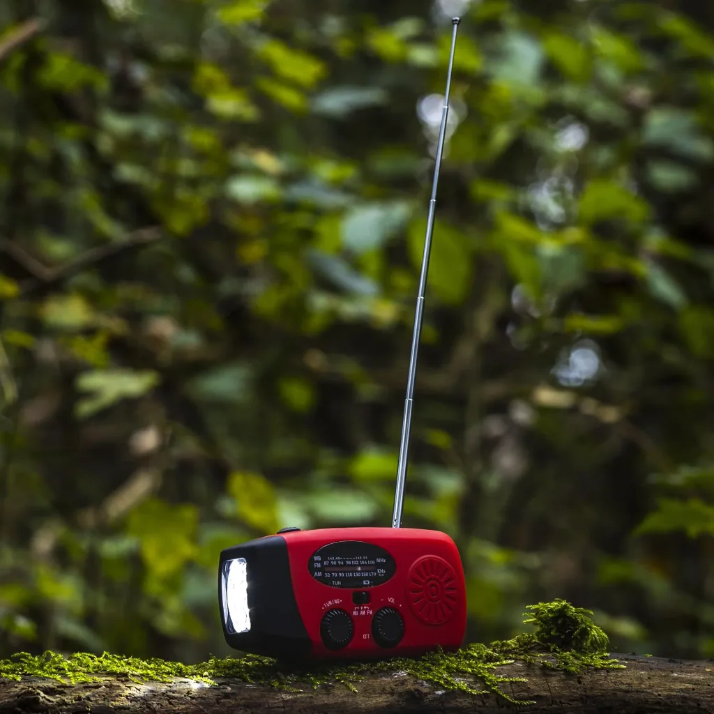 Portable solar crank radio with flashlight, power bank function