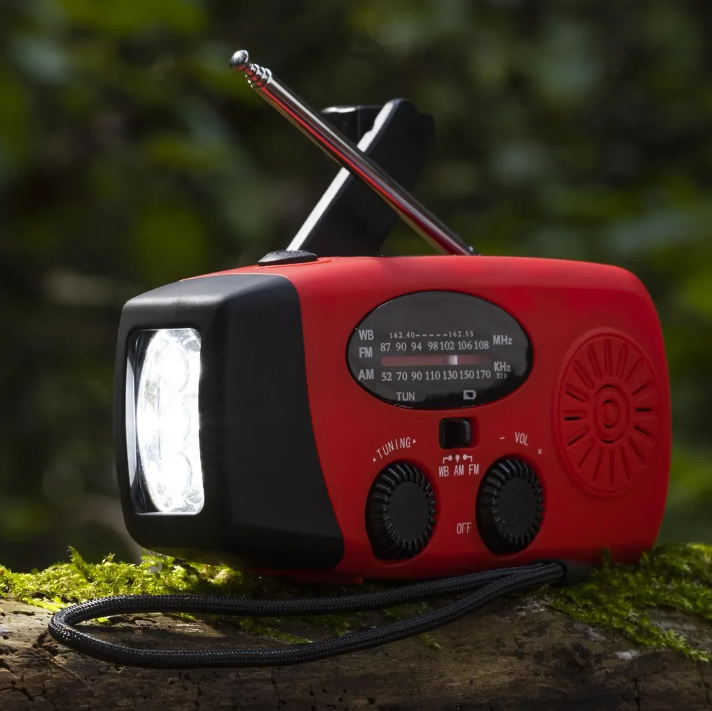 Portable solar crank radio with flashlight, power bank function