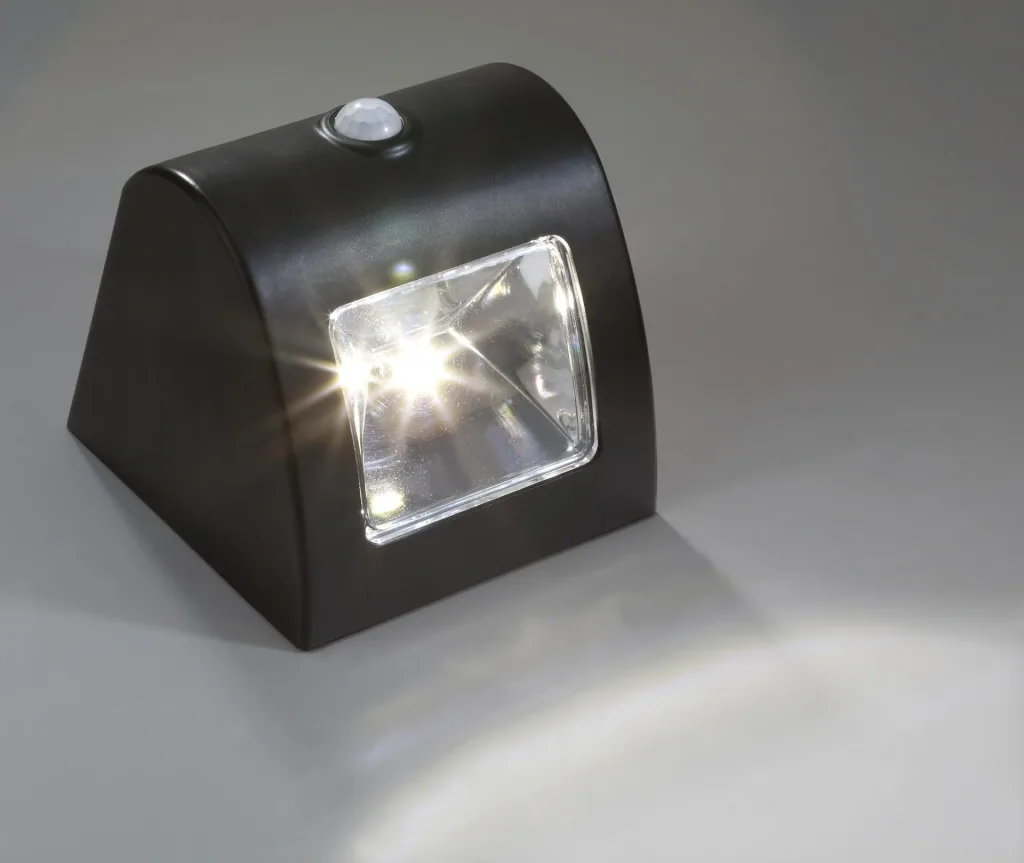 Solar wall and fence light with motion detector