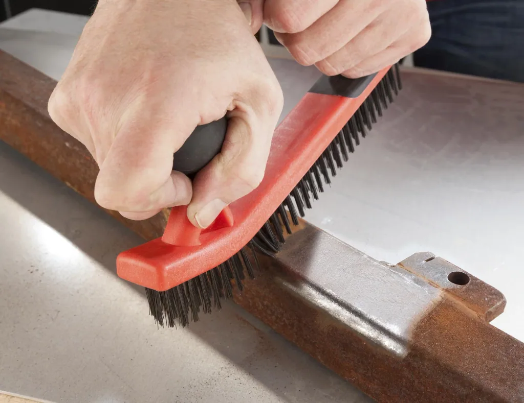 Body steel brush with 2 components soft-touch handle
