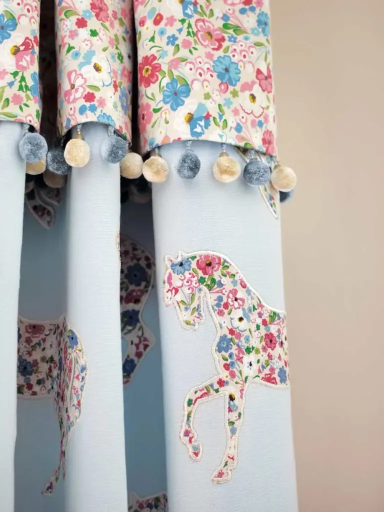 Little Sanderson Abracazoo motif fabric applies horses cream light blue