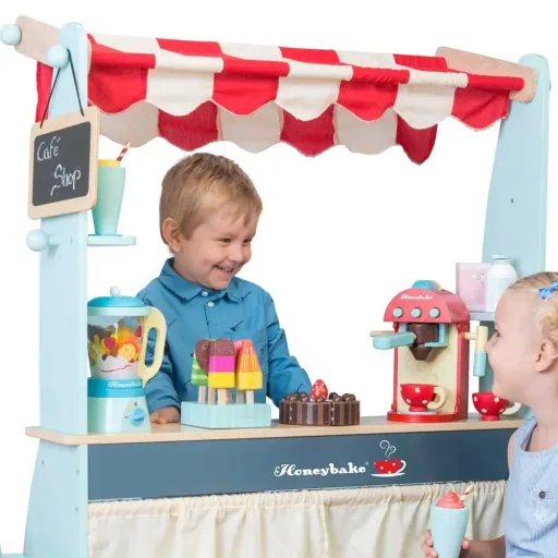 Le Toy van sales stand and Café Honeybake