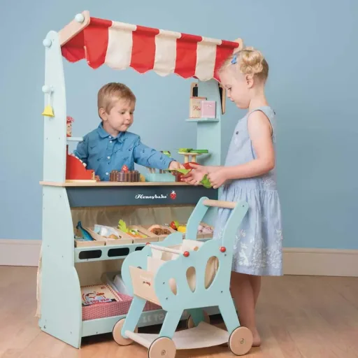 Le Toy van sales stand and Café Honeybake