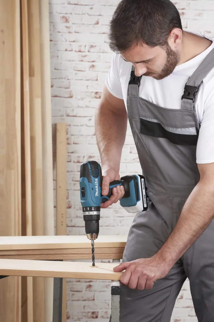 Cordless impact drill HP457DWE10, 18 Volt - 2-speed, Li-Ion with 74-piece accessories