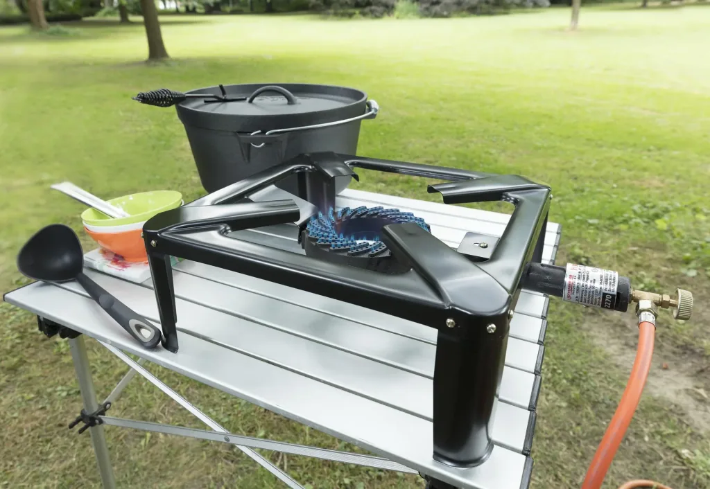 Stool cooker including hose and regulator