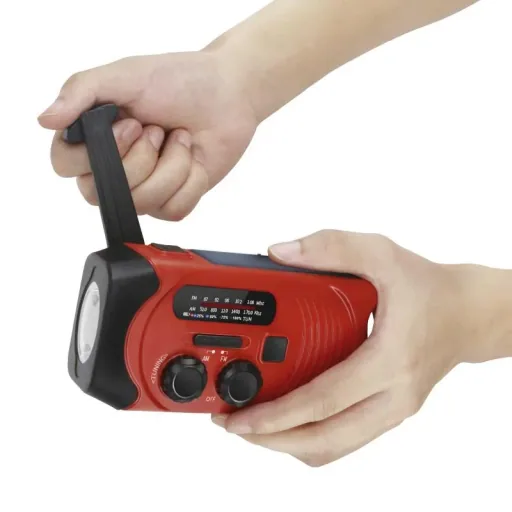 Portable solar crank radio with flashlight, rechargeable and battery operation