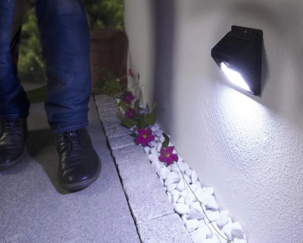 Solar wall light with infrared motion detector