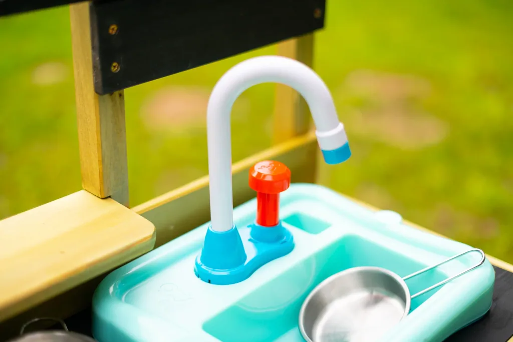 Wooden children's play kitchen with sink
