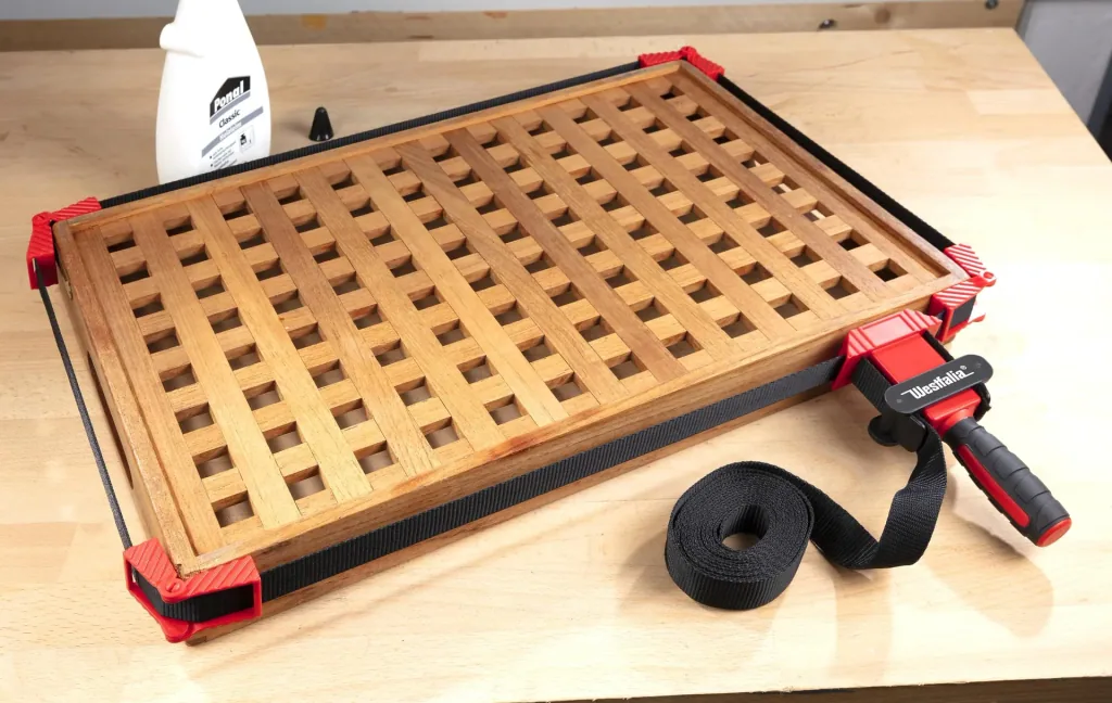 Band tensioners for frames and molds